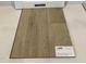 Close-up of Shaw luxury vinyl plank flooring in a soft beige color at 368 Chesapeak Commons St # 132, Garner, NC 27529