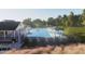 Community pool area with lounge seating and plenty of space to relax, swim, and sunbathe at 368 Chesapeak Commons St # 132, Garner, NC 27529