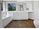Bright bathroom with a double sink vanity, a soaking tub, and large window with a view at 3708 Mackinac Island Ln, Raleigh, NC 27610