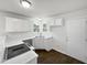 Well-lit kitchen featuring stainless steel appliances, quartz countertops, and ample cabinet space at 3708 Mackinac Island Ln, Raleigh, NC 27610