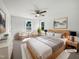 Sun-filled main bedroom with neutral tones, a ceiling fan, and stylish modern decor at 3708 Mackinac Island Ln, Raleigh, NC 27610