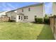Home's exterior features siding, a sunroom, and a patio, set in a green yard, providing a comfortable outdoor space at 3709 Althorp Dr, Raleigh, NC 27616