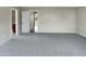 Bedroom with plush gray carpet, neutral paint, and a view to the hallway at 3709 Althorp Dr, Raleigh, NC 27616