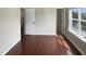 Bedroom featuring hardwood floors, natural light, and a view to the hallway at 3709 Althorp Dr, Raleigh, NC 27616