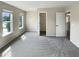 Bedroom featuring neutral carpeting, sunlit windows, and an open closet presents a serene retreat at 3709 Althorp Dr, Raleigh, NC 27616