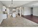 Open-concept kitchen featuring an island, granite countertops, and modern white cabinets at 3709 Althorp Dr, Raleigh, NC 27616