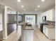 Open-concept kitchen featuring granite countertops, stainless steel appliances, and a spacious island at 3709 Althorp Dr, Raleigh, NC 27616