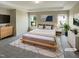 Bright main bedroom with a tray ceiling, neutral decor, and a large window for ample natural light at 3709 Althorp Dr, Raleigh, NC 27616