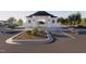 Elegant white community entrance with black accents, landscaping, and convenient parking at 376 Chesapeak Commons St # 130, Garner, NC 27529