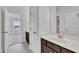 Bathroom featuring dark cabinets, white countertops, and modern fixtures at 384 Grey Hawk Dr, Garner, NC 27529