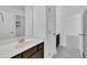 Bathroom featuring dark cabinets, white countertops, and tiled floors at 384 Grey Hawk Dr, Garner, NC 27529