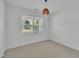 Bedroom featuring neutral carpet and natural light from the window at 384 Grey Hawk Dr, Garner, NC 27529