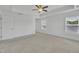Bedroom featuring neutral carpet, tray ceilings and bright natural light at 384 Grey Hawk Dr, Garner, NC 27529