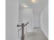 Upstairs hallway showing carpet and wooden railing at 384 Grey Hawk Dr, Garner, NC 27529