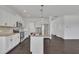 Bright kitchen with stainless steel appliances, granite countertops, and a central island at 384 Grey Hawk Dr, Garner, NC 27529