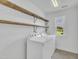 Laundry room with washer, dryer, shelving, and window at 384 Grey Hawk Dr, Garner, NC 27529