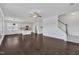 Open-concept living room and kitchen with hardwood floors and ample space at 384 Grey Hawk Dr, Garner, NC 27529