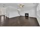 Spacious living room featuring a fireplace, stairs, and views of the entry way at 384 Grey Hawk Dr, Garner, NC 27529