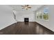 Bright living room with hardwood floors, fireplace, and plenty of natural light at 384 Grey Hawk Dr, Garner, NC 27529