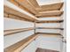 Unique wooden storage shelves inside a closet at 384 Grey Hawk Dr, Garner, NC 27529