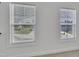 Window views of the exterior greenery providing ample natural light and privacy at 384 Grey Hawk Dr, Garner, NC 27529