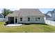 The well-maintained backyard features a screened-in porch and a charming porch swing at 412 Kavanaugh Rd, Wake Forest, NC 27587