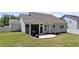 This backyard includes a screened-in porch and a porch swing in the yard at 412 Kavanaugh Rd, Wake Forest, NC 27587