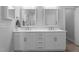Bathroom featuring a double vanity with modern fixtures and a large mirror at 412 Kavanaugh Rd, Wake Forest, NC 27587