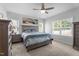 Cozy bedroom with neutral walls, carpet, and natural light filtering through the windows at 412 Kavanaugh Rd, Wake Forest, NC 27587