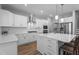 Bright kitchen with stainless steel appliances, a gas stove, and a large island with seating at 412 Kavanaugh Rd, Wake Forest, NC 27587