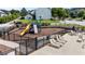 Community playground with slides, climbing structures, and seating for parents to watch at 412 Kavanaugh Rd, Wake Forest, NC 27587
