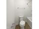 A full bathroom with a toilet, shower with bathtub, chrome fixtures and tile flooring at 4169 Weavers Pond Dr, Zebulon, NC 27597