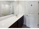 Bathroom featuring a vanity with modern sink, large mirror, and white paneled doors at 4169 Weavers Pond Dr, Zebulon, NC 27597
