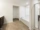 Clean bathroom featuring a separate tub, glass shower, and ceramic tile flooring at 4169 Weavers Pond Dr, Zebulon, NC 27597