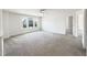 Large, sunlit bedroom with neutral carpet and a view of the neighborhood at 4169 Weavers Pond Dr, Zebulon, NC 27597