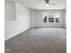 Bright bonus room features carpeted floor and large windows offering neighborhood views at 4169 Weavers Pond Dr, Zebulon, NC 27597