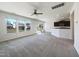Spacious living room with great natural light, neutral carpeting, and seamless flow to the kitchen at 4169 Weavers Pond Dr, Zebulon, NC 27597