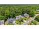 Aerial view of a residential home in a lush, wooded neighborhood at 4608 Regency Dr, Durham, NC 27713