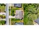 An aerial view of a home with a well-maintained roof, mature trees, and a deck overlooking the lush backyard at 4608 Regency Dr, Durham, NC 27713