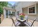 Relax on the deck, with views of the lush backyard, with dining area and sliding door access to the house at 4608 Regency Dr, Durham, NC 27713