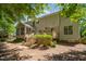 Backyard with a two-level wooden deck surrounded by tall trees and shrubbery at 4608 Regency Dr, Durham, NC 27713