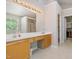 Bright bathroom with double sinks, tile flooring, walk-in shower, and natural light from a window at 4608 Regency Dr, Durham, NC 27713