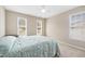 Bedroom with carpet and three windows at 4608 Regency Dr, Durham, NC 27713