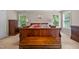 Bedroom with neutral walls, carpet, dark wood furniture, and bright natural light at 4608 Regency Dr, Durham, NC 27713