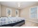 Bedroom with window, carpet, ceiling fan and neutral colored walls at 4608 Regency Dr, Durham, NC 27713