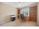 Bedroom with desk, shelving, carpeted floors, a ceiling fan, and natural lighting at 4608 Regency Dr, Durham, NC 27713