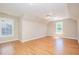 Bonus room with vaulted ceilings, hardwood flooring, neutral colored walls, and natural light from a window at 4608 Regency Dr, Durham, NC 27713