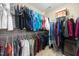 Walk-in closet with extensive hanging space and built-in shelving at 4608 Regency Dr, Durham, NC 27713