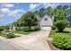 Inviting two-story home featuring a long driveway, a well-kept lawn, mature trees, and meticulous landscaping at 4608 Regency Dr, Durham, NC 27713