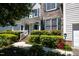 Charming home with a welcoming front porch, lush landscaping, and a delightful 'Welcome' sign at 4608 Regency Dr, Durham, NC 27713